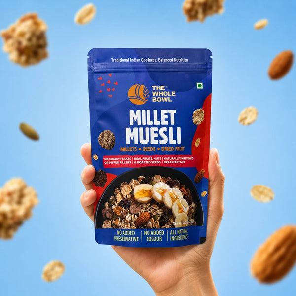 A hand holding the Millet Muesli pouch